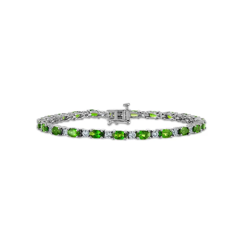 raw tanzanite accent bracelet-5X3MM Oval Chrome Diopside and Topaz 7-inch Tennis Bracelet in Rhodium Plated Sterling Silver