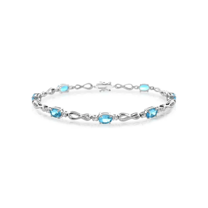 modern sleek ridge bracelet-Blue Topaz Infinity 7.5-inch Bracelet in Sterling Silver