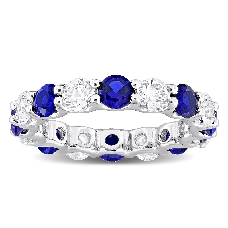 artisan-crafted gold ring-Miadora 5ct TGW Created Blue Sapphire and Created White Sapphire Eternity Ring in Sterling Silver