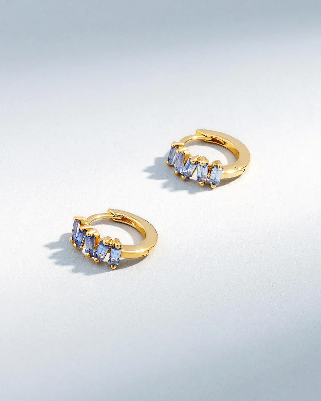 polished gold stack earrings-Bold Light Blue Sapphire Huggies